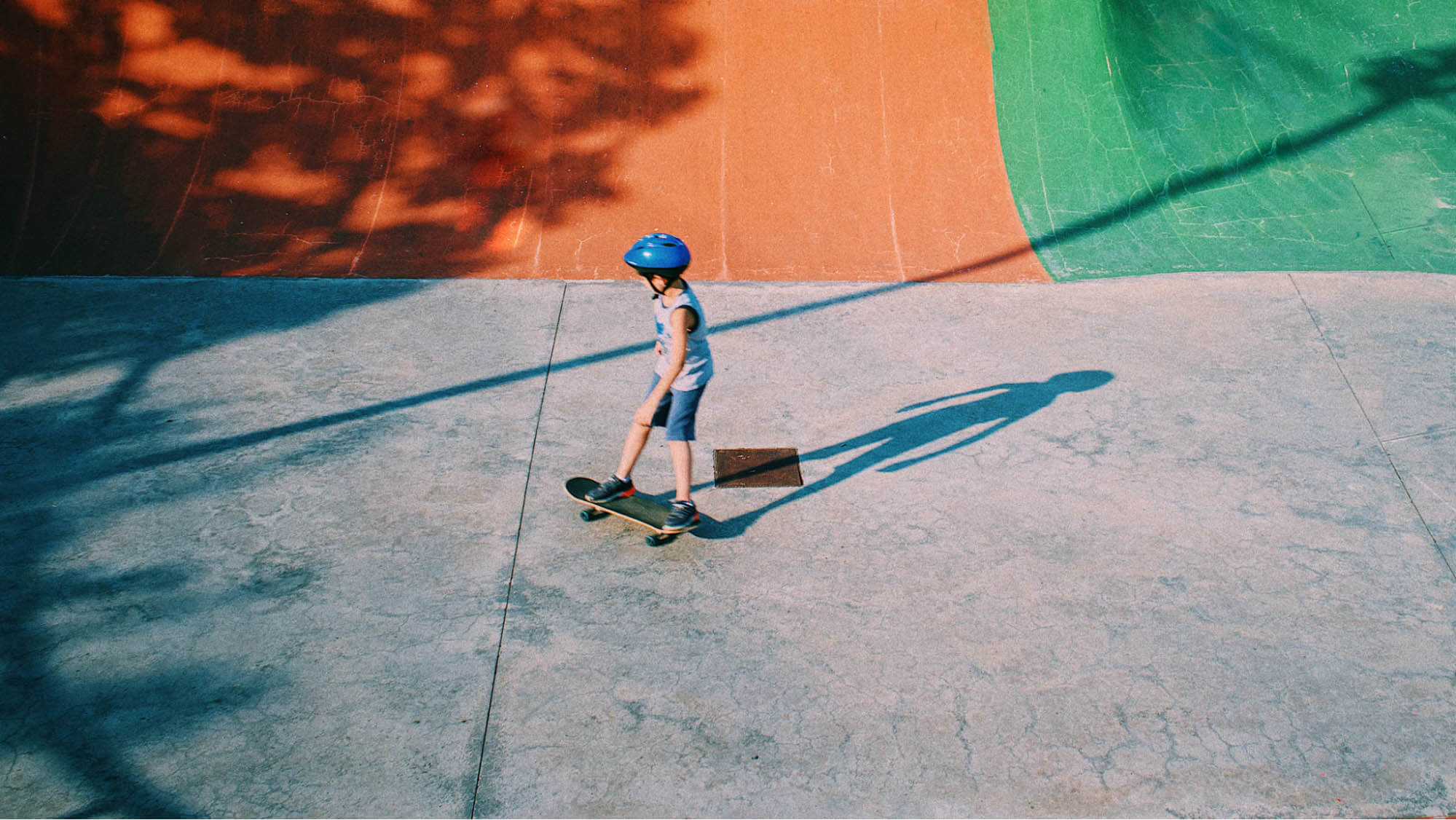 kid-skating-at-skatepark-helmet